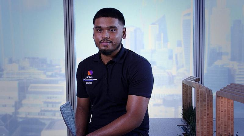 Mitie male electrical engineering apprentice sitting by the window view in The Shard